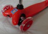 Фото Самокат трехколесный со светящимися колесами красный 1toy