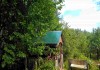 Фото Шикарный участок 25 соток ИЖС в лесу под Печорами, бытовка и баня.