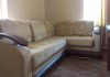 Фото Угловой диван из бежевого текстиля